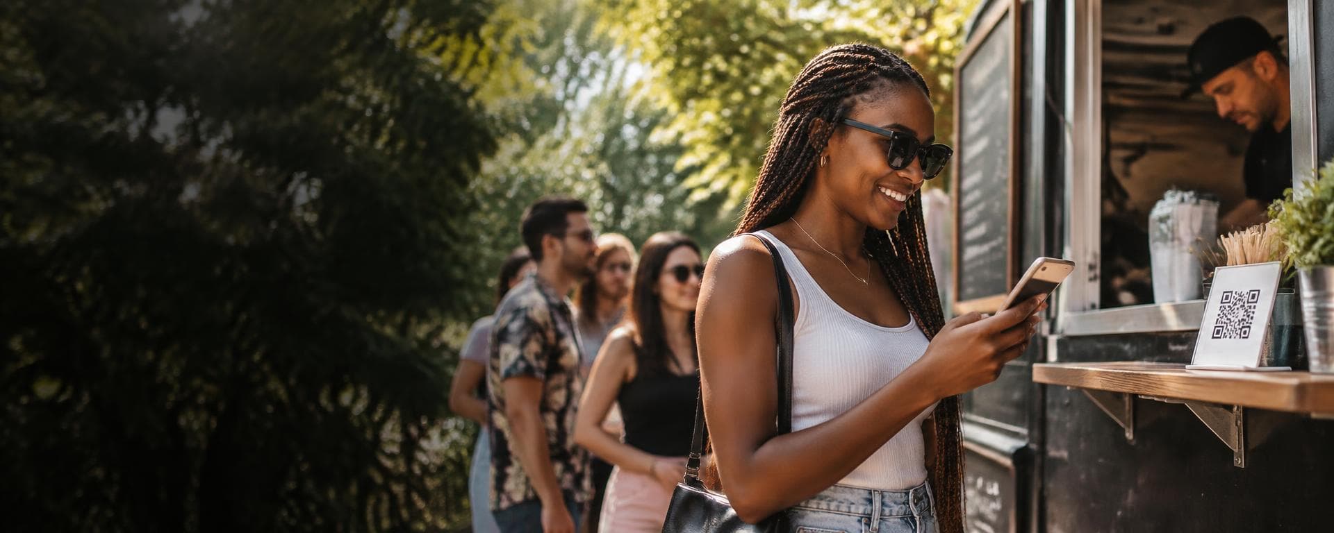 A guest ordering on her phone at a food truck